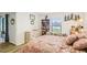 Bright bedroom features hardwood floors, a view of the lake and cozy decorative elements at 636 Chatham Walk Dr, Ruskin, FL 33570