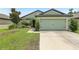 Charming single-Gathering home with a manicured lawn, mature landscaping and an attached two-car garage at 636 Chatham Walk Dr, Ruskin, FL 33570