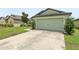 Lovely single-story home with a well-kept lawn and an attached two-car garage, offering curb appeal and convenience at 636 Chatham Walk Dr, Ruskin, FL 33570