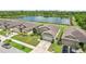 Beautiful single-story home with lush green lawn and convenient driveway, located near a peaceful lake at 636 Chatham Walk Dr, Ruskin, FL 33570