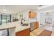 Kitchen featuring wood cabinets, granite counters, white subway tile backsplash, and stainless steel appliances at 636 Chatham Walk Dr, Ruskin, FL 33570