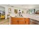 Bright kitchen featuring granite countertops and stainless steel appliances at 636 Chatham Walk Dr, Ruskin, FL 33570