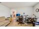 Home office with wood flooring, desk, computer, and natural light with a view into the kitchen at 636 Chatham Walk Dr, Ruskin, FL 33570