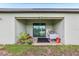 Covered patio with sliding glass door and tile flooring, perfect for outdoor relaxation at 636 Chatham Walk Dr, Ruskin, FL 33570