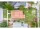 Aerial view of the property showcasing the home, its well-kept roof, and the surrounding neighborhood at 6408 N Central Ave, Tampa, FL 33604