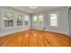 Bright bedroom with refinished hardwood floors and updated windows and trim at 6408 N Central Ave, Tampa, FL 33604