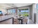 Elegant dining room with stylish decor, neutral color scheme, and picturesque outdoor views at 6653 Flint Creek Dr, Land O Lakes, FL 34638