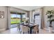 Inviting dining room featuring a large sliding door with outdoor views at 6653 Flint Creek Dr, Land O Lakes, FL 34638