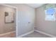 Bright laundry room with tile floors, window, and utility connections at 6653 Flint Creek Dr, Land O Lakes, FL 34638