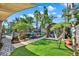 Backyard featuring artificial turf, trampoline, hammock, and shed with an outdoor shower at 6844 34Th N Ave, St Petersburg, FL 33710