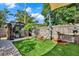 Relaxing backyard retreat with artificial turf, hammock, shed, and privacy fence at 6844 34Th N Ave, St Petersburg, FL 33710