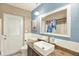 Bathroom with a new vanity, large mirror, and a shower/tub combo at 6844 34Th N Ave, St Petersburg, FL 33710
