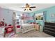 Bedroom with a bunk bed, ceiling fan, and multiple windows at 6844 34Th N Ave, St Petersburg, FL 33710