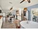 Open floor plan showcases the kitchen, dining area, and living room with sliding doors to the lanai at 6844 34Th N Ave, St Petersburg, FL 33710