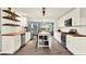 Bright, modern kitchen with white cabinets, wood countertops, stainless steel appliances, and hardwood floors at 6844 34Th N Ave, St Petersburg, FL 33710