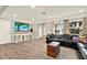Well-lit living room with hardwood floors, modern decor, and large windows, perfect for relaxation and entertaining at 6844 34Th N Ave, St Petersburg, FL 33710
