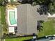 Aerial shot of the home with a pool, showcasing the roof and surrounding landscaping at 6865 Circle Creek Dr, Pinellas Park, FL 33781