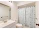 Clean bathroom featuring a tub with a shower, a vanity, and a toilet at 6865 Circle Creek Dr, Pinellas Park, FL 33781