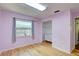 Bedroom featuring wood floor, window, and a closet at 6865 Circle Creek Dr, Pinellas Park, FL 33781