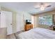 Cozy bedroom featuring a window, ceiling fan, and closet for ample storage at 6865 Circle Creek Dr, Pinellas Park, FL 33781