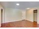 An open concept living space featuring laminate floor and a closet at 6865 Circle Creek Dr, Pinellas Park, FL 33781
