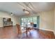 Open-concept living room featuring a dining area and sliding doors to the outdoor space at 6865 Circle Creek Dr, Pinellas Park, FL 33781