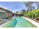 Sparkling outdoor pool provides a relaxing retreat with lush tropical landscaping and an inviting gazebo at 6865 Circle Creek Dr, Pinellas Park, FL 33781