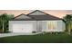 Charming single-story home featuring an attached garage and beautifully landscaped front yard, creating a welcoming curb appeal at 9728 Redwood Heights Loop, Thonotosassa, FL 33592