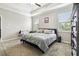 Bedroom features tray ceiling, neutral walls, carpet, and two windows with blinds at 9816 Ivory Dr, Sun City Center, FL 33573