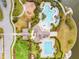 Aerial view shows the community pool, clubhouse, playground, and nearby walking trails at 9816 Ivory Dr, Sun City Center, FL 33573