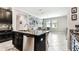 Kitchen with granite counters and stainless appliances adjacent to the dining area at 9816 Ivory Dr, Sun City Center, FL 33573