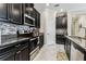 Updated kitchen offers granite countertops, stainless appliances and views to the breakfast room at 9816 Ivory Dr, Sun City Center, FL 33573