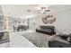 Open-concept living and dining areas featuring neutral paint and tile flooring at 9816 Ivory Dr, Sun City Center, FL 33573