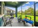 An outdoor patio with a grill, table, chairs, and play sets for a relaxing atmosphere at 9816 Ivory Dr, Sun City Center, FL 33573
