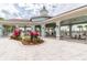 Outdoor pavilion with tables, chairs, and landscaped grounds at 9816 Ivory Dr, Sun City Center, FL 33573