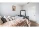 Well-lit bedroom with neutral walls, carpet, ceiling fan, and a large mirror at 10436 Villa View Cir, Tampa, FL 33647