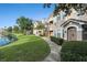 Exterior view of the home near a pond at 10436 Villa View Cir, Tampa, FL 33647