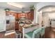 Cozy kitchen with granite countertops, stainless steel appliances, and dark wood cabinets, complemented by a breakfast bar at 10436 Villa View Cir, Tampa, FL 33647