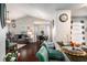 Open-concept living area featuring hardwood floors, neutral walls, and comfortable seating, blending into dining space at 10436 Villa View Cir, Tampa, FL 33647