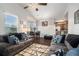 Open-concept living space with hardwood floors, and a dining area adjacent to the kitchen for easy entertaining at 10436 Villa View Cir, Tampa, FL 33647