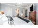 Comfortable main bedroom features ceiling fan, neutral walls, and an ensuite bathroom with a shower at 10436 Villa View Cir, Tampa, FL 33647
