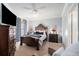 Comfortable main bedroom features neutral walls, ceiling fan, natural light, and ample space at 10436 Villa View Cir, Tampa, FL 33647