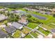 Aerial view of a suburban neighborhood with houses and a lake at 11130 Summer Star Dr, Riverview, FL 33579