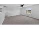 Bright bedroom with plush carpet, a ceiling fan, and a window view at 11130 Summer Star Dr, Riverview, FL 33579