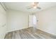 Inviting bedroom features stylish wood-look floors and a closet for ample storage at 11130 Summer Star Dr, Riverview, FL 33579