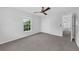 Bedroom featuring carpet, a window, and a ceiling fan at 11130 Summer Star Dr, Riverview, FL 33579