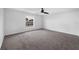 Clean, empty bedroom with a ceiling fan and a large window at 11130 Summer Star Dr, Riverview, FL 33579