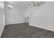 Bright open living room with gray wood floors, staircase and high ceilings at 11130 Summer Star Dr, Riverview, FL 33579