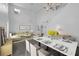 Staged open-plan living and dining area with elegant furnishings and decor at 11130 Summer Star Dr, Riverview, FL 33579