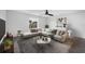 Stylish living room with a comfortable sectional sofa and modern decor at 11130 Summer Star Dr, Riverview, FL 33579